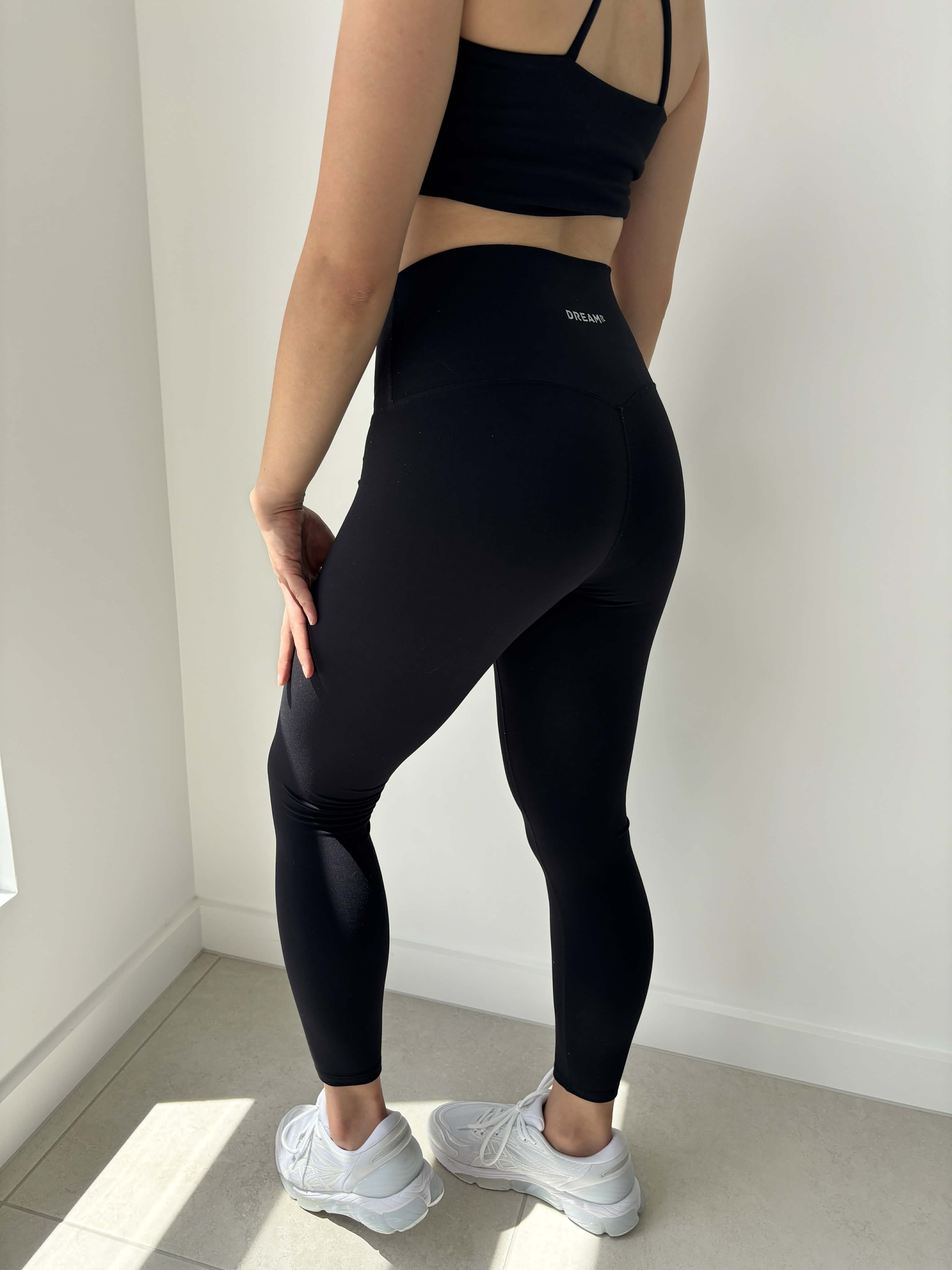 Wearing black leggings by DREAMR Australia